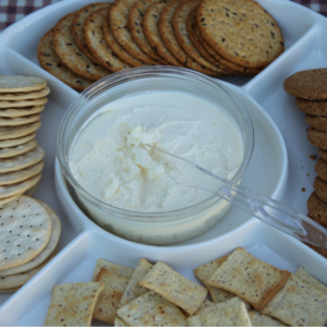 Pumpkin Vine Family Farm maple walnut chevre cheese with crackers.