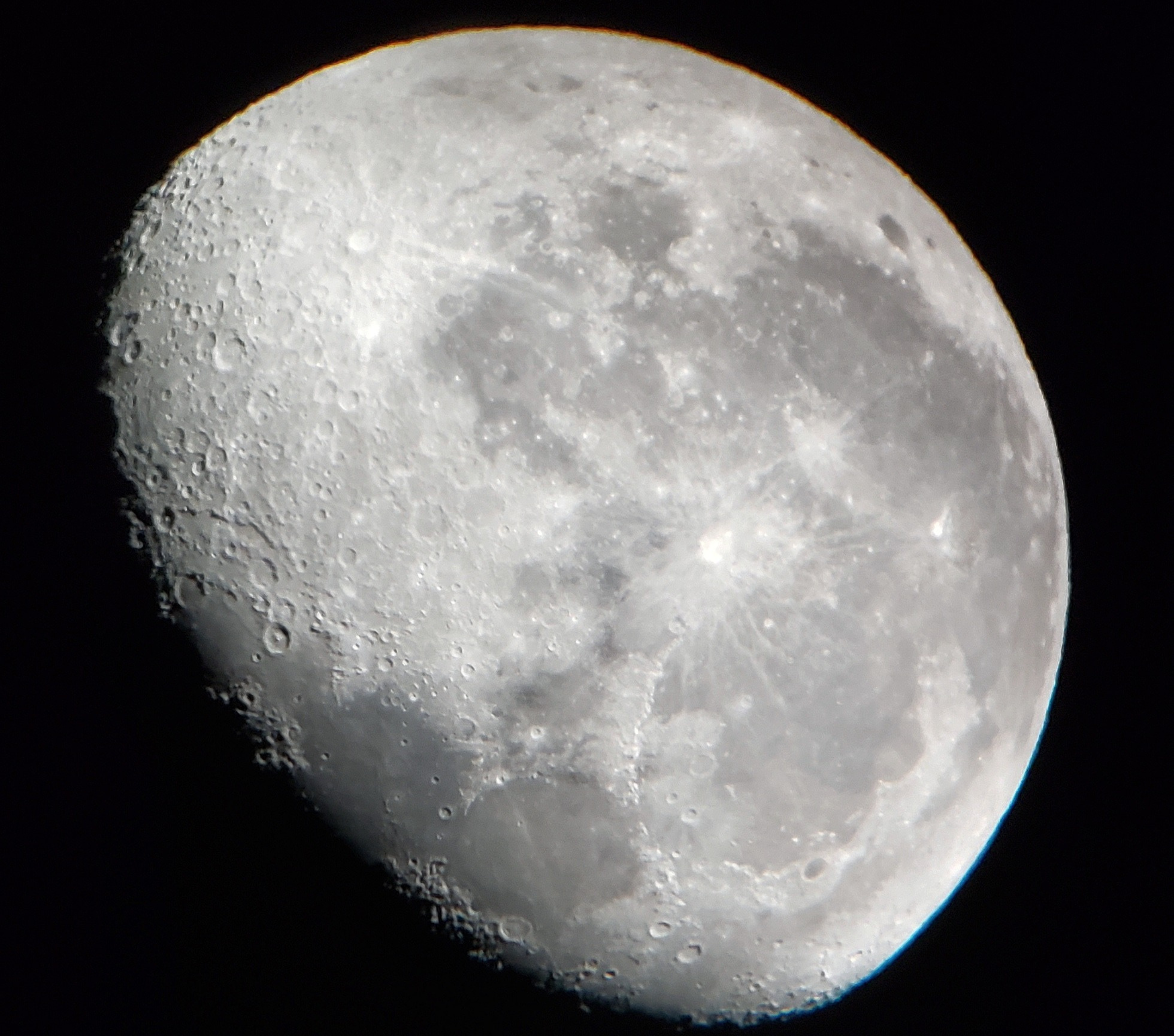 Large white moon on a black background.