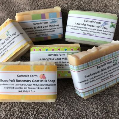 Group of soaps of different kinds with colorful labels for Summit Farm